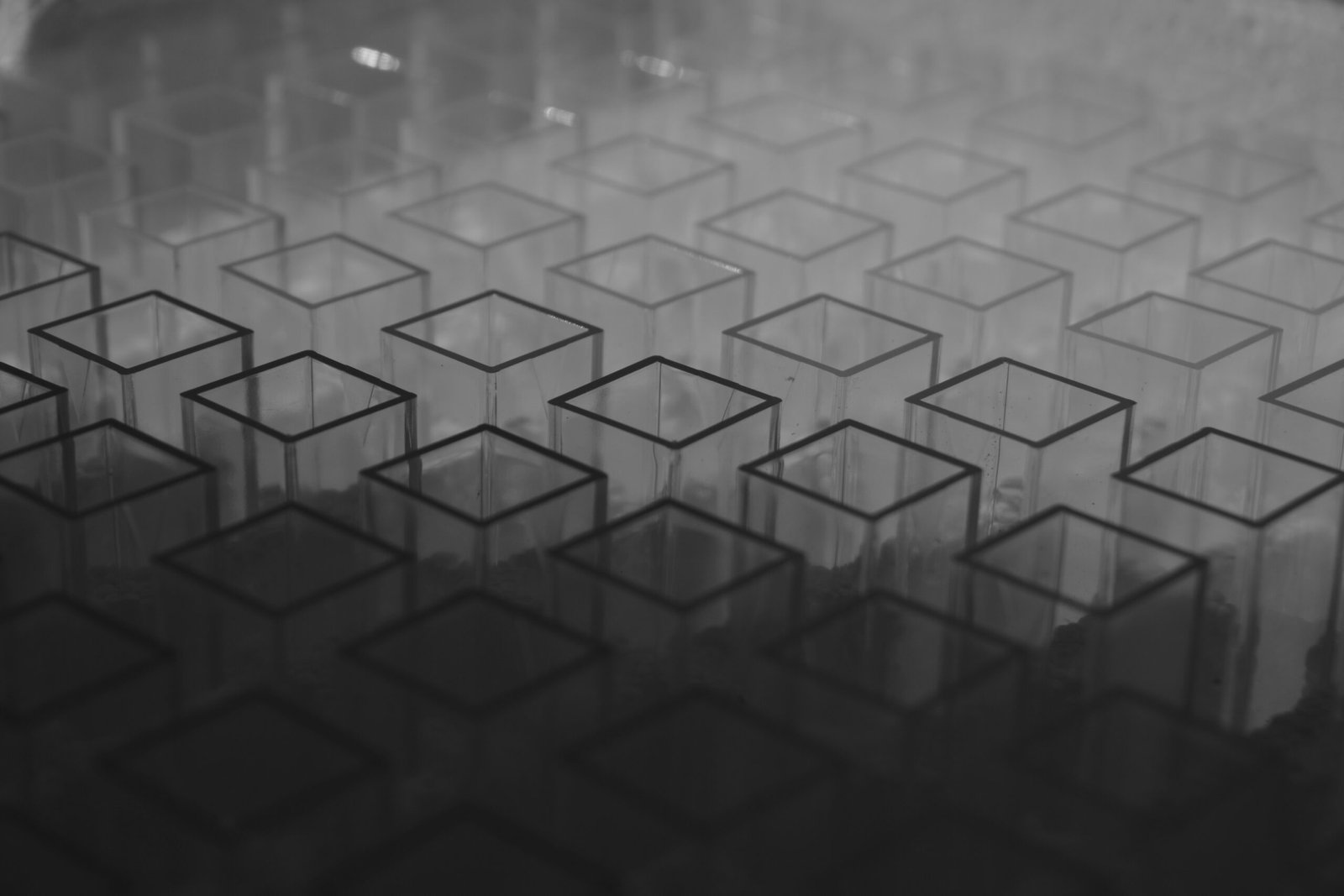 A black and white photo of a pattern of cubes