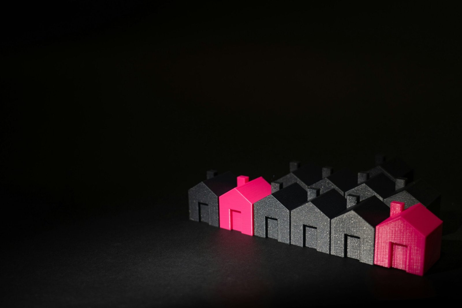 A row of small houses sitting on top of a table