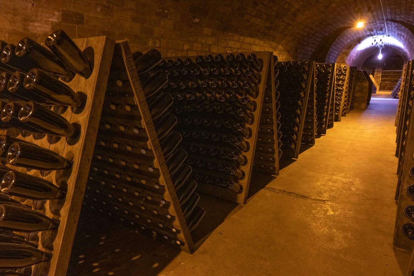 A tunnel filled with lots of bottles of wine