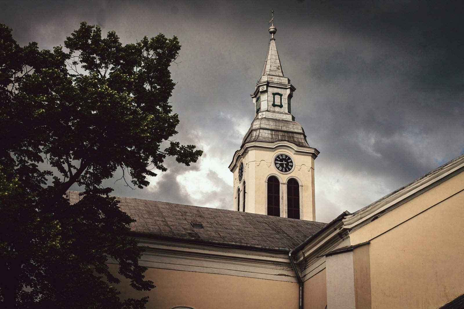 a church steeple with a clock on it