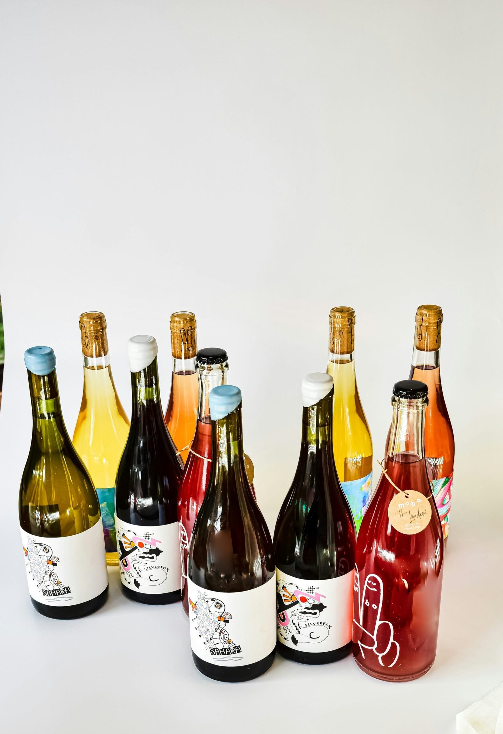 a group of bottles of wine sitting next to each other