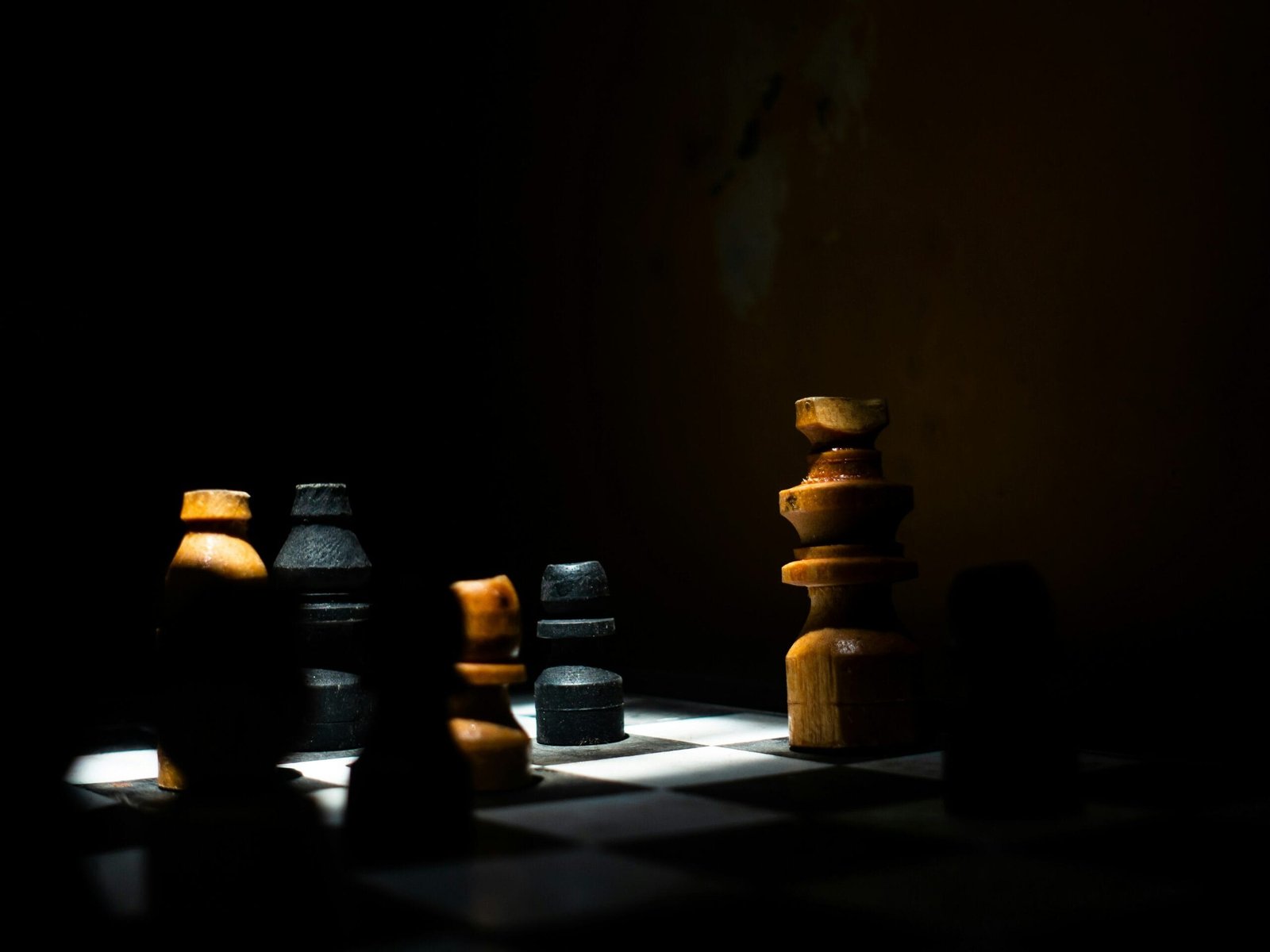 a group of chess pieces sitting on top of a chess board