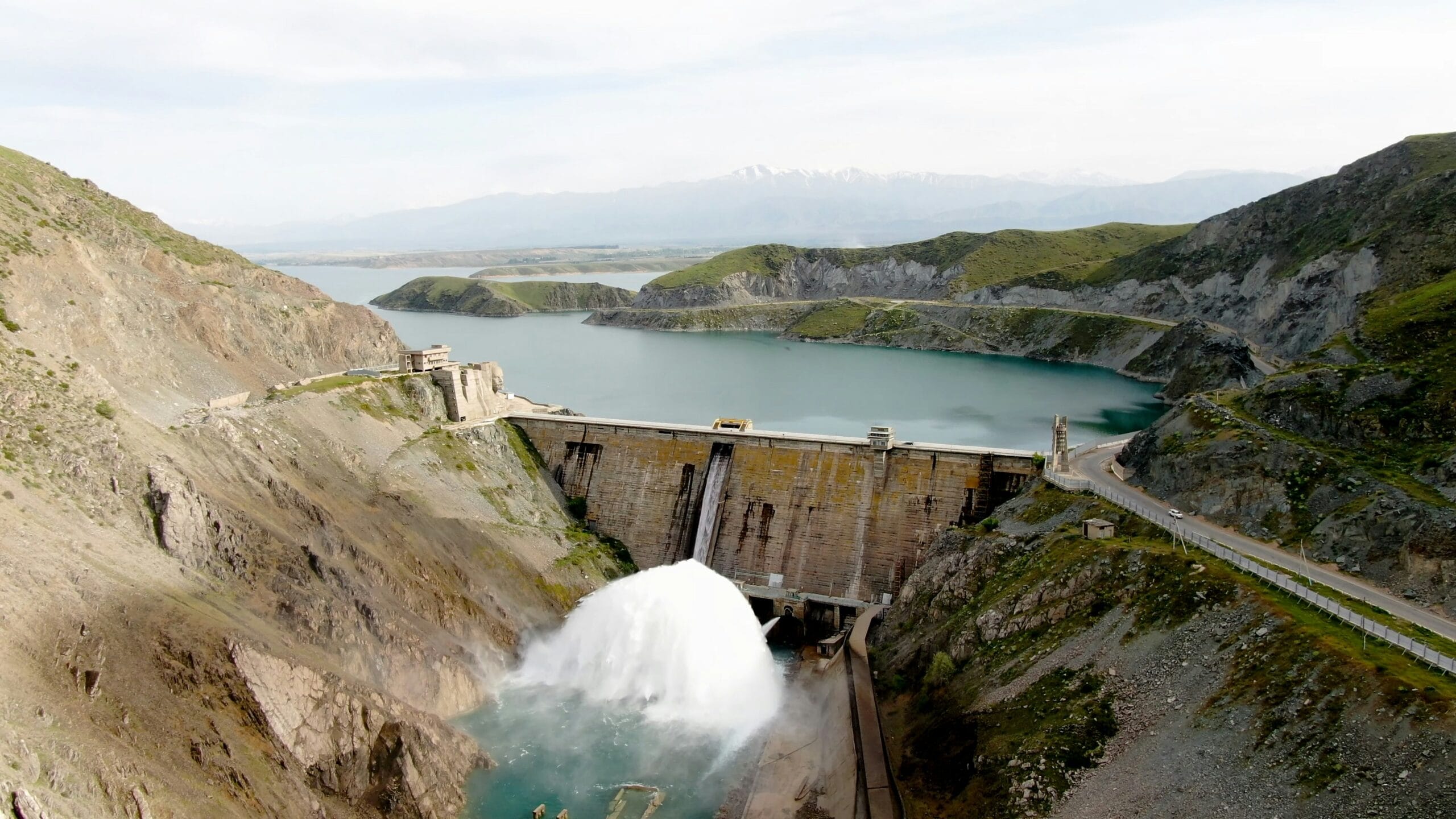 a large dam with water coming out of it