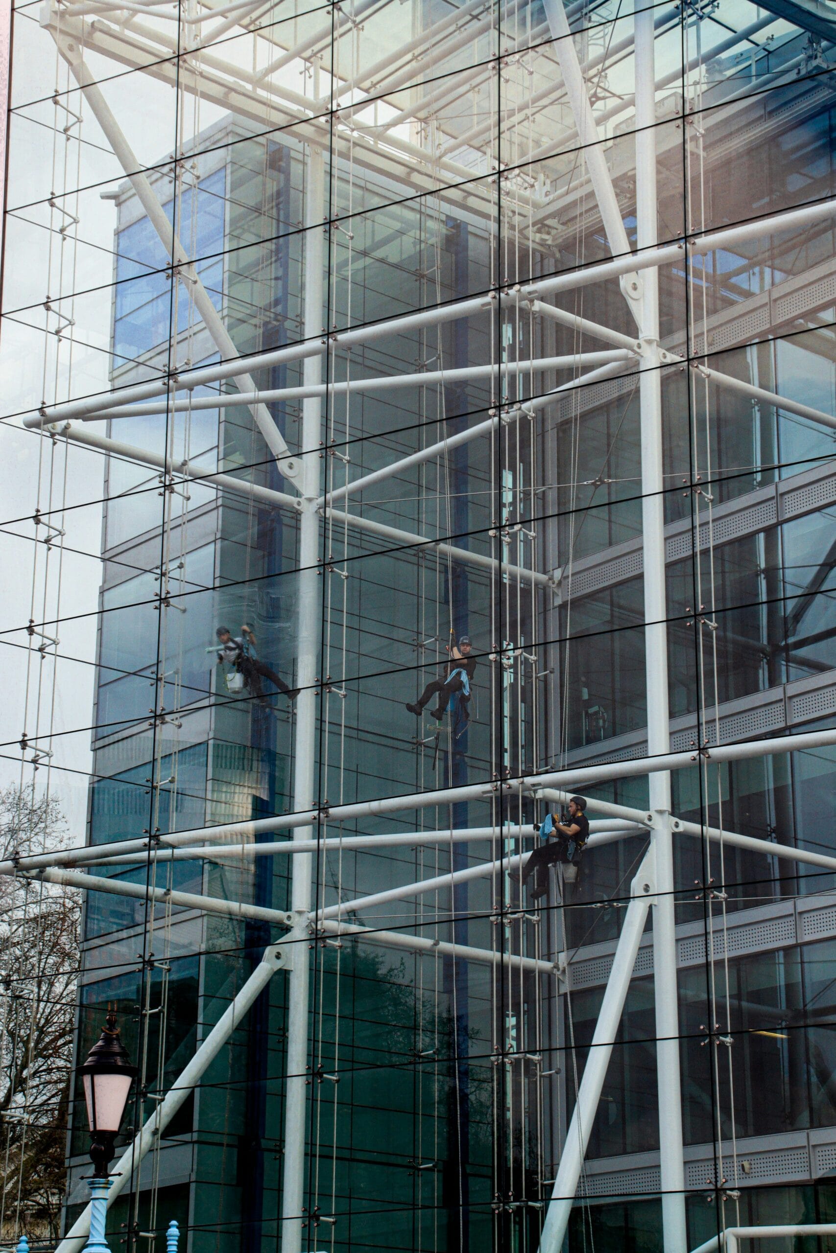 a man on a scaffolding system working on a building