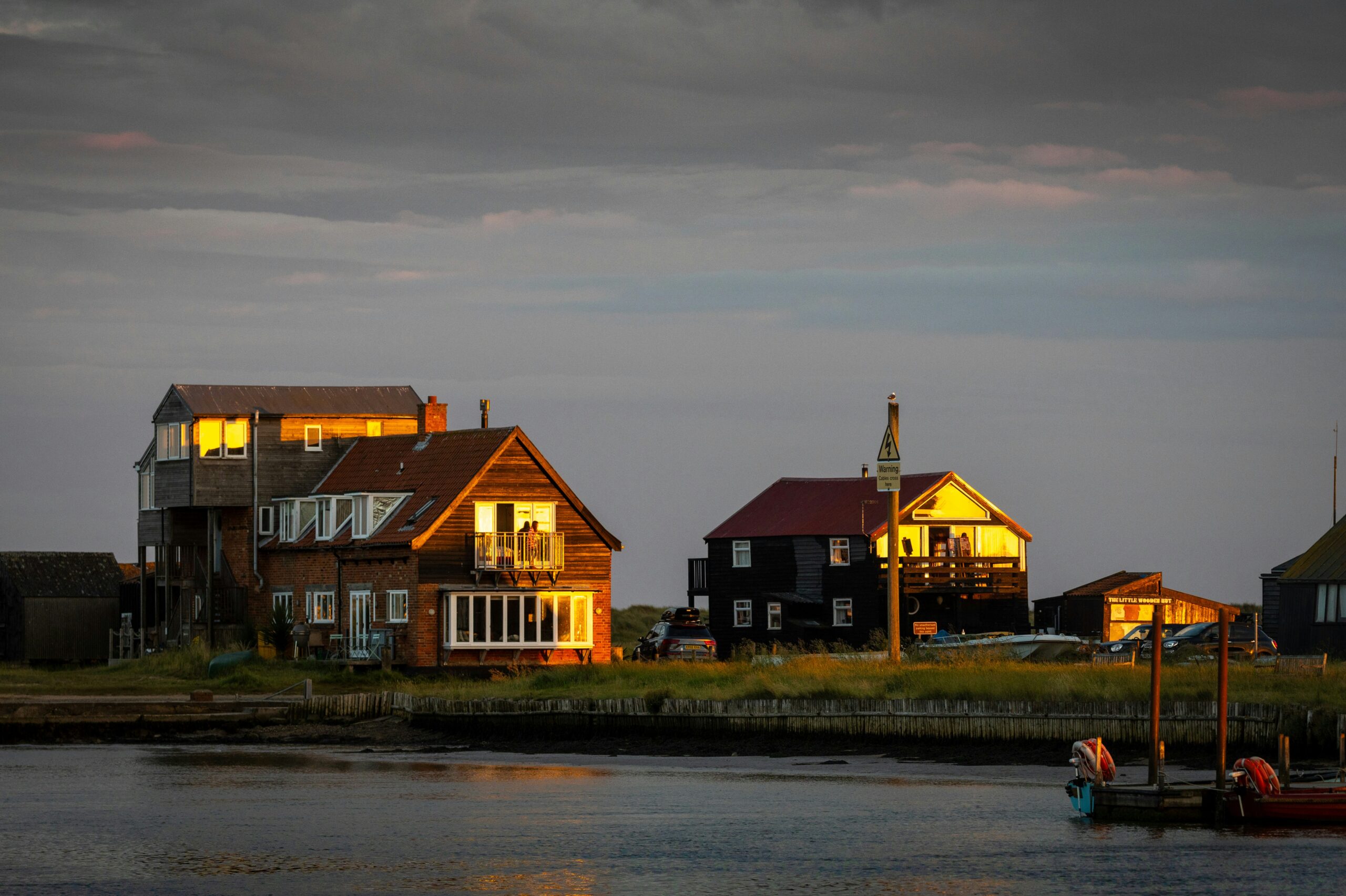 a row of houses next to a body of water