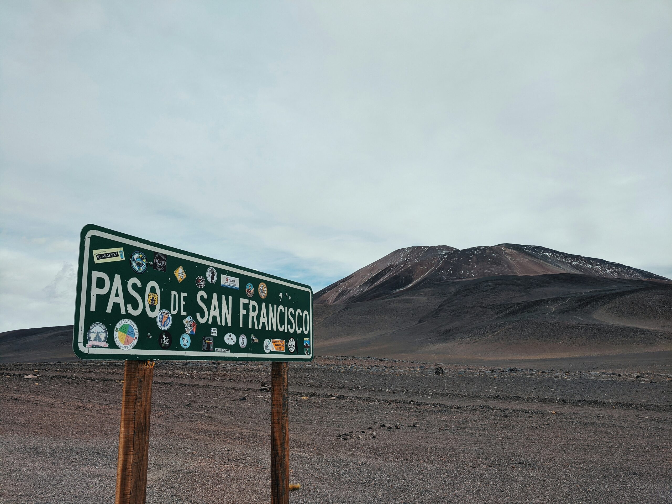 a street sign in the middle of a desert