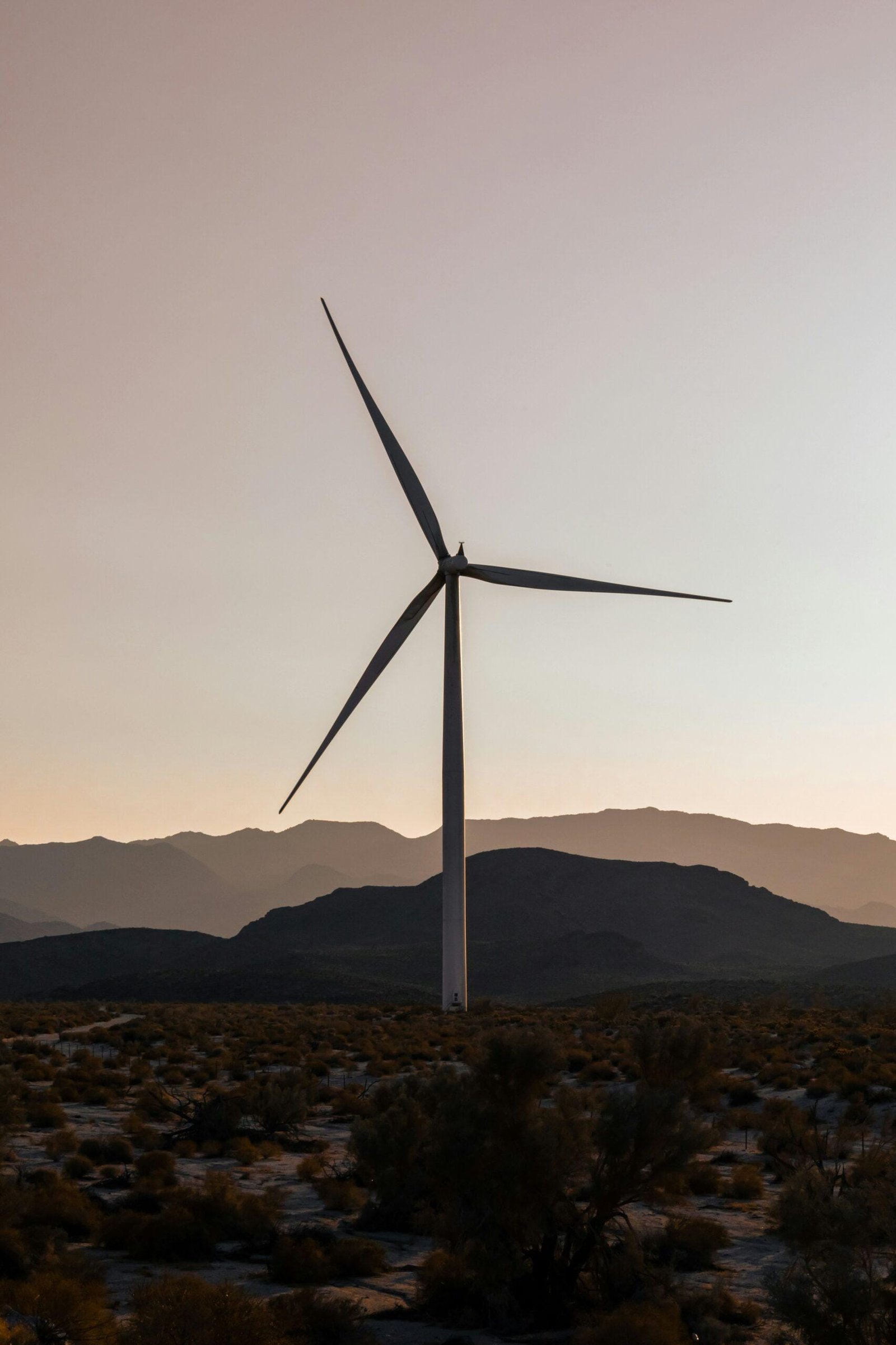 a wind turbine in the middle of a desert