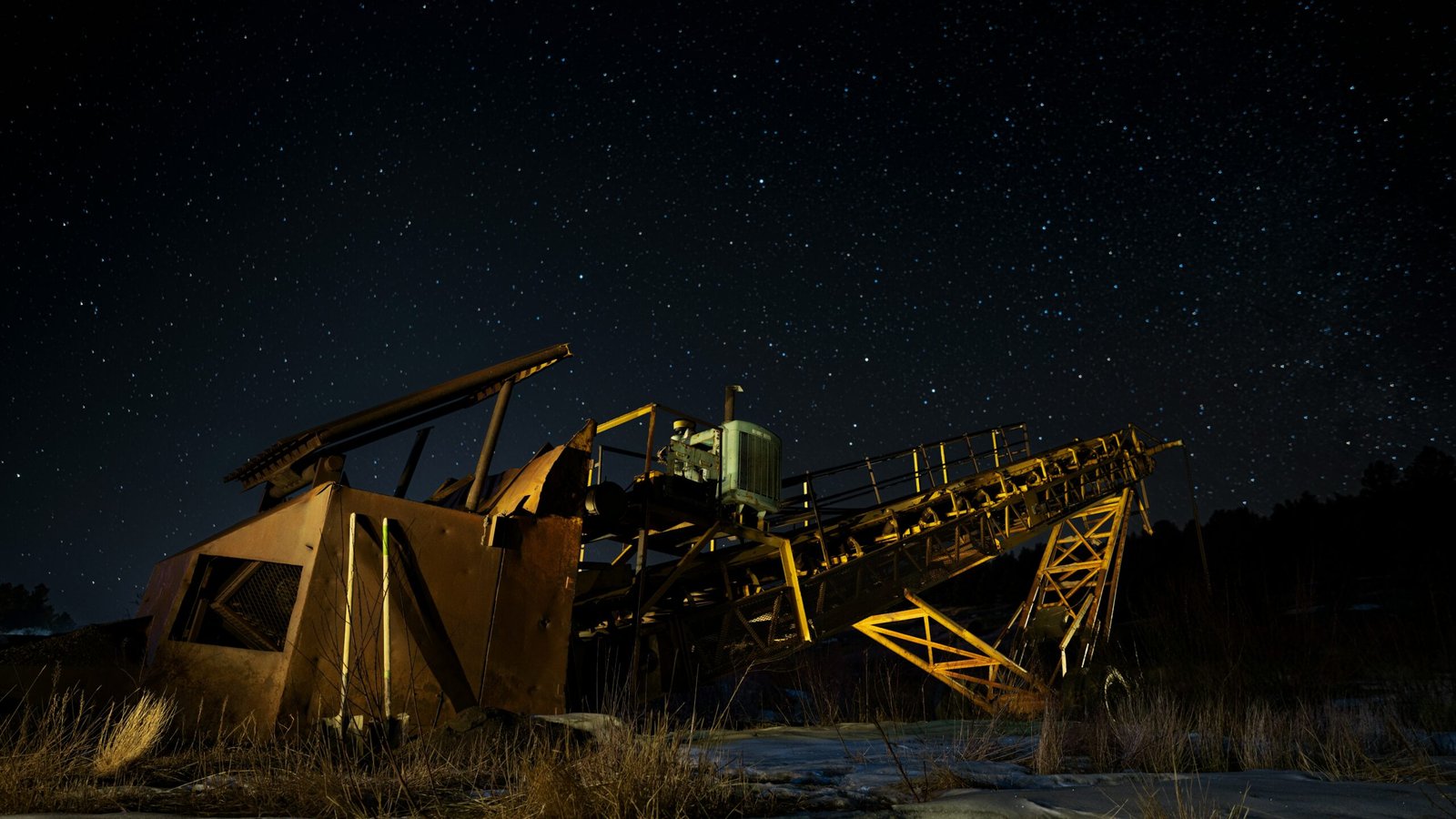 brown and black metal crane under starry night