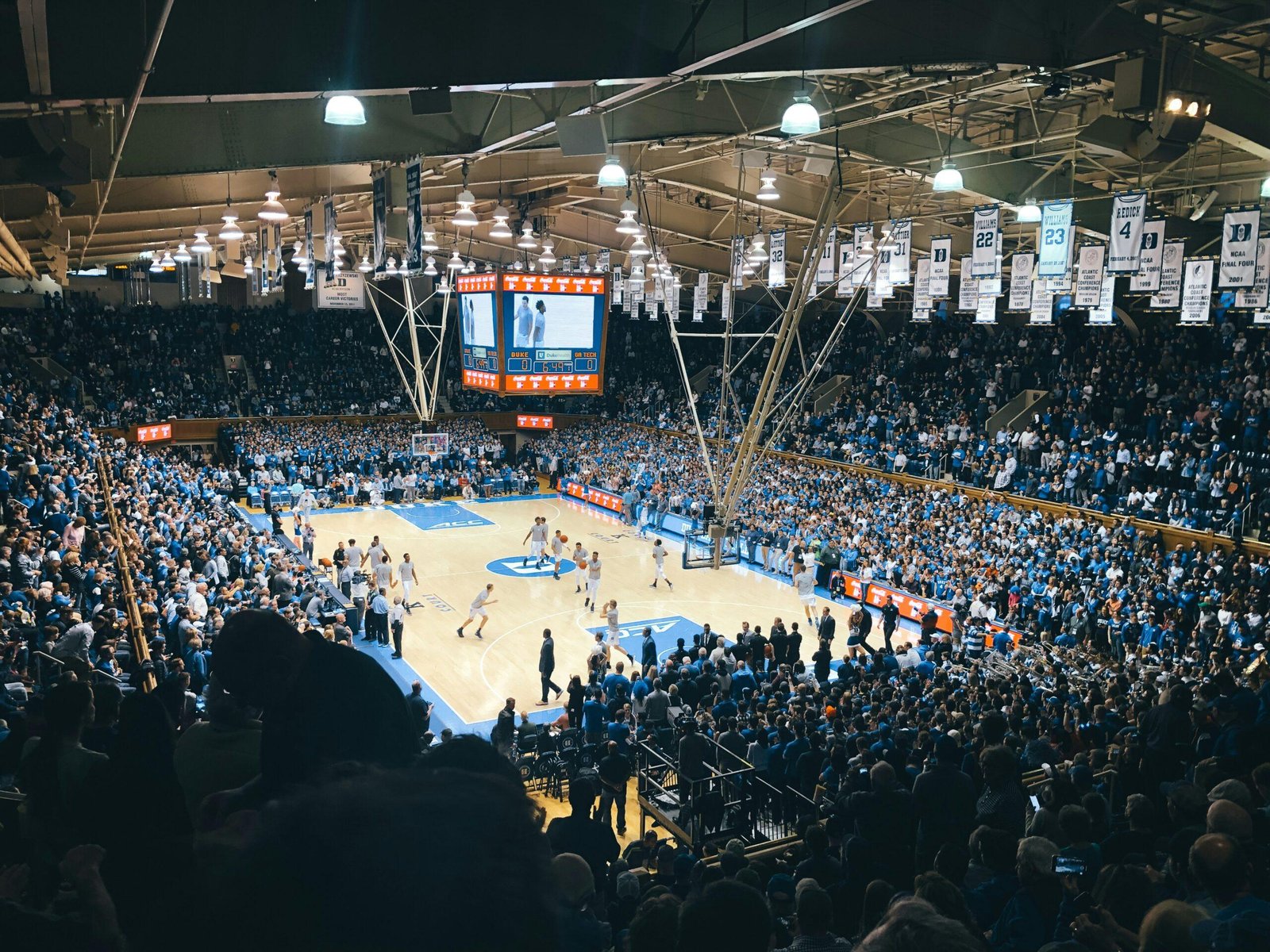 group of people at basketball stadium