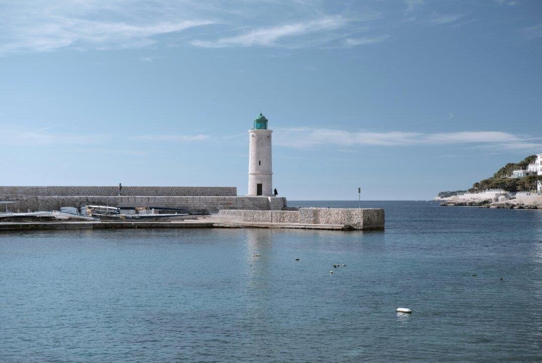 light house and body of water