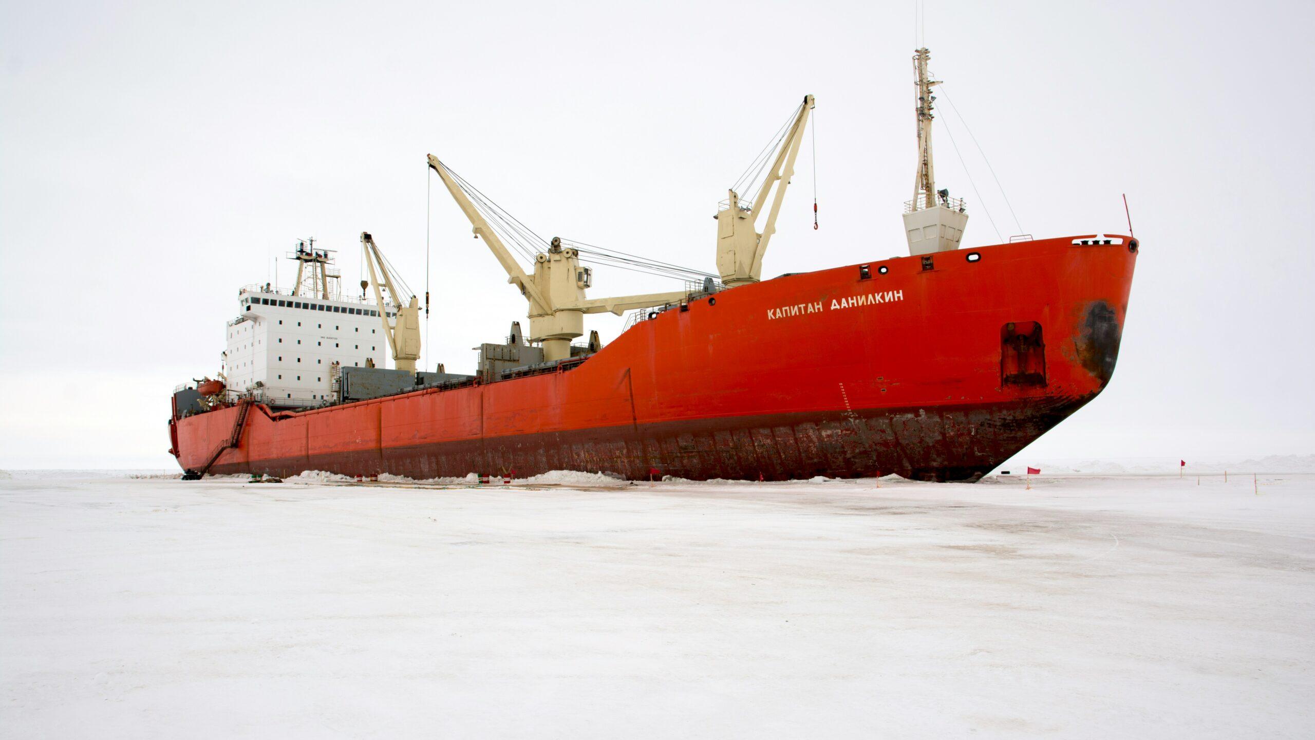 red and white ship on sea during daytime