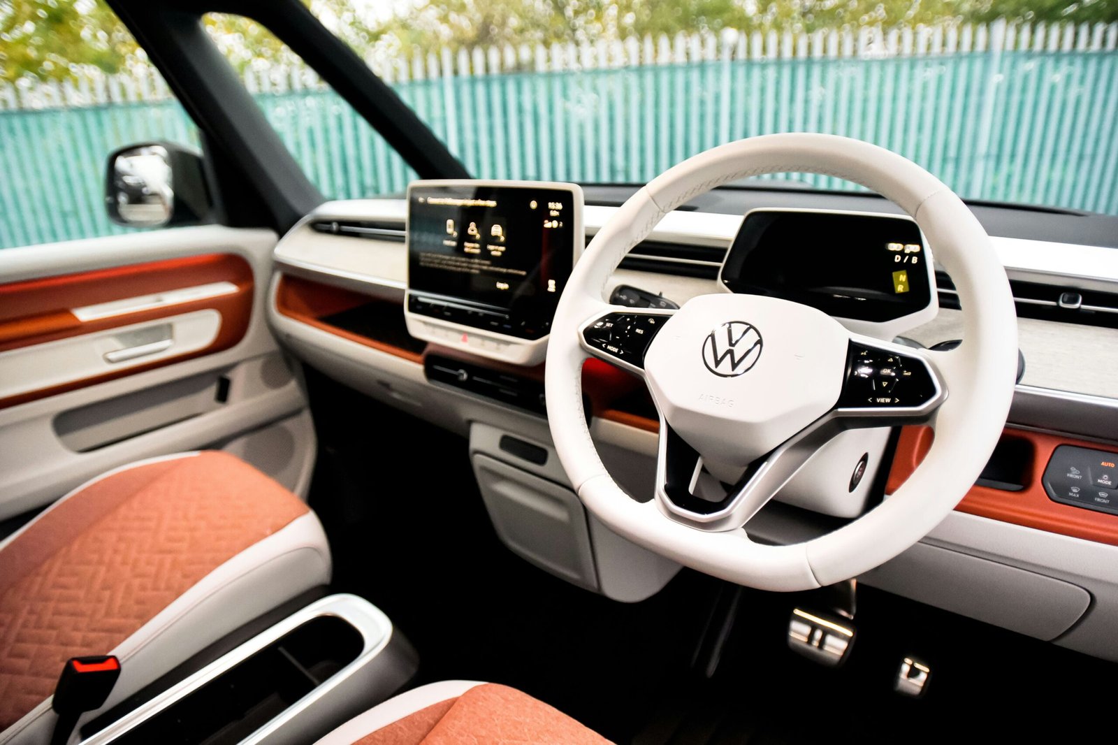 the interior of a car with a steering wheel and dashboard