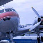 A propeller plane sitting on top of a tarmac