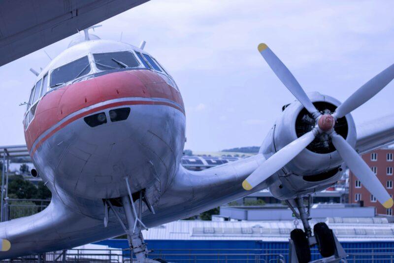 A propeller plane sitting on top of a tarmac